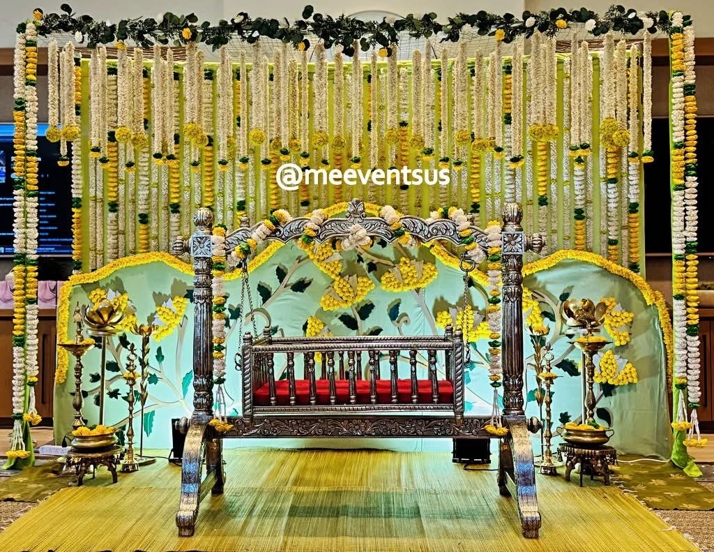 Decorated floral swing with marigold and white garlands