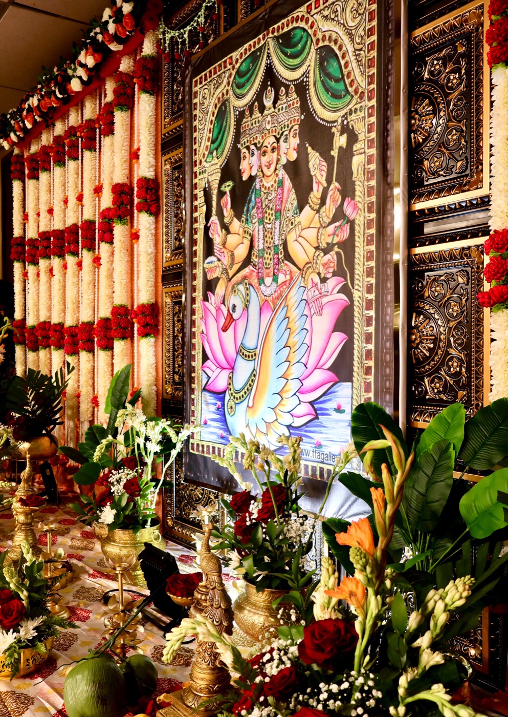Gajalakshmi deity backdrop with carved gold panels
